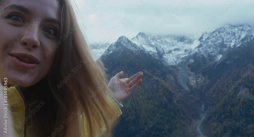 Beautiful Caucasian female hipster hiker making a selfie or video call in front of Mont Blanc massif. Smartphone camera POV. 4K UHD RAW 60 FPS SLO MO Beautiful Caucasian female hipster hiker making a selfie or video call in front of Mont Blanc massif. Smartphone camera POV. 4K UHD RAW 60 FPS SLO MO