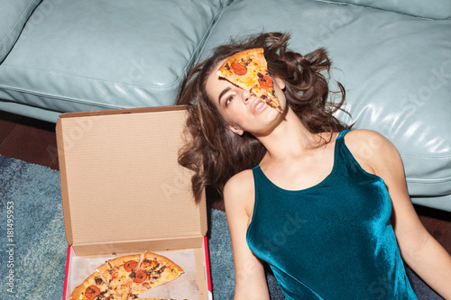 pretty woman with pizza on her face photo