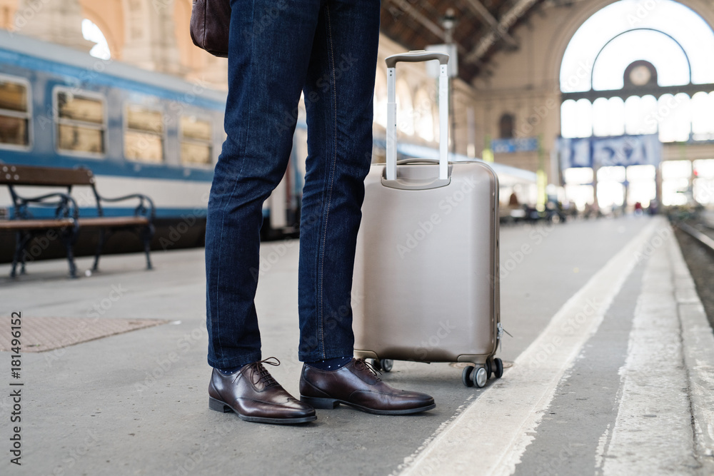 Mature businessman on a train station. Mature businessman on a train station.