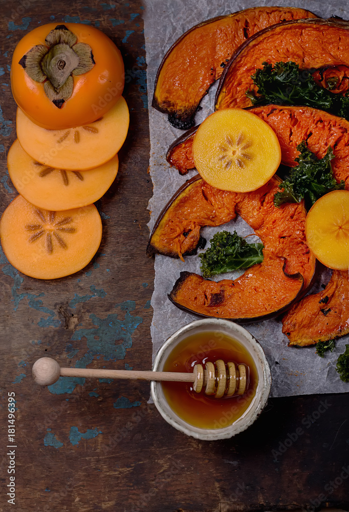 Baked Pumpkin with kale, persimmon and feta