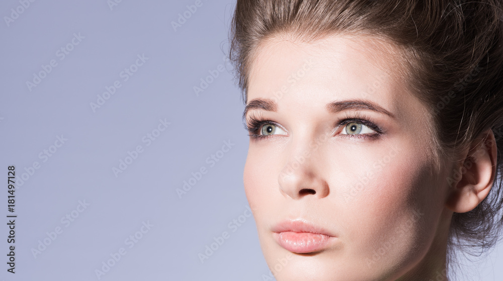 Obraz premium Beauty portrait. Closeup face of a beautiful young woman with professional make-up nude