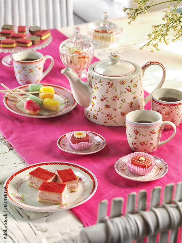 high tea on a table with a pink tablecloth high tea on a table with a pink tablecloth