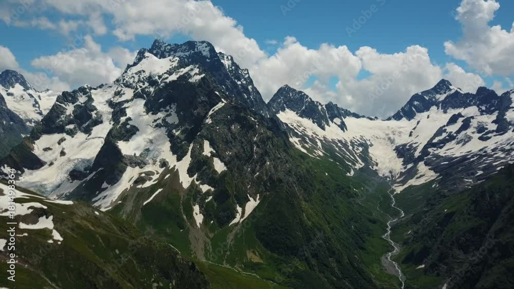 Flight over Mount Dombai, Caucasus, Russia. Republic of Karachay-Cherkessia Flight over Mount Dombai, Caucasus, Russia. Republic of Karachay-Cherkessia