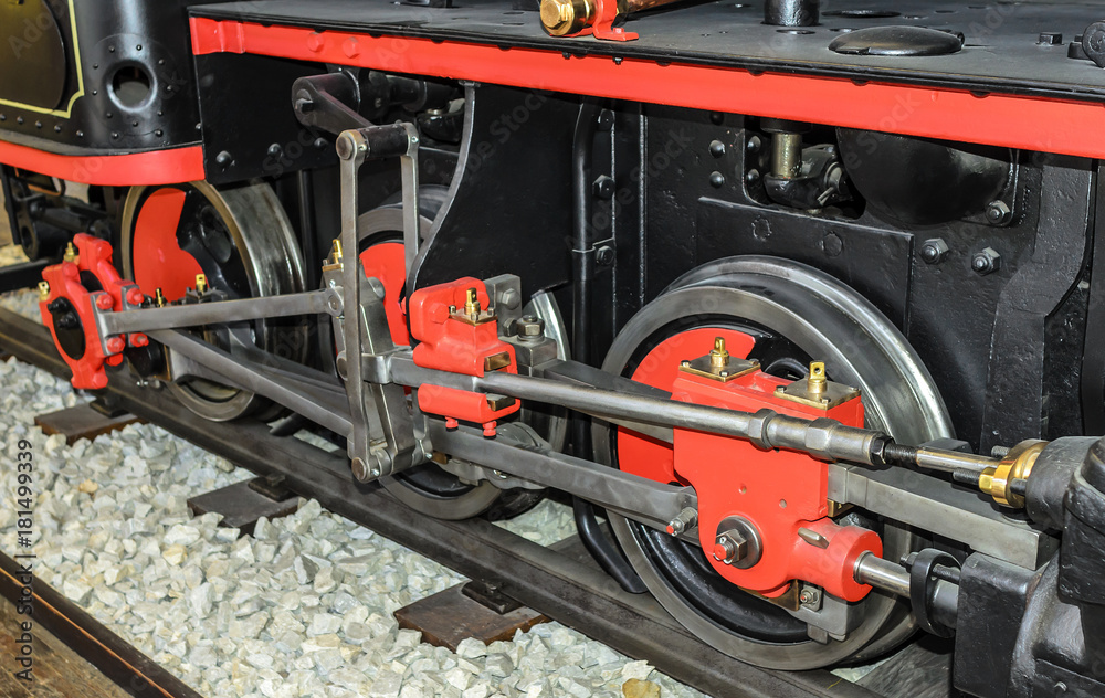 Locomotive wheels are close-up.