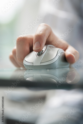 man using his vingers to control a cordless mouse