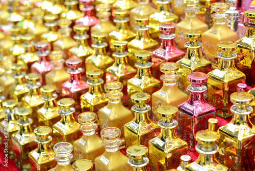Glass perfume bottles based oils. A Bazaar, market. Macro. 