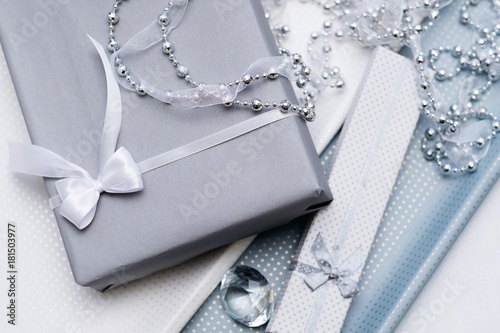 luxury jewelry gifts for top class on grey background. professional present wrapping for toffs on birthday, new year, christmas, thanksgiving, valentines day and other holidays. photo