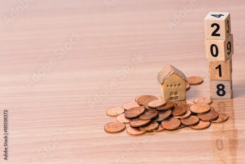 The wooden cube for new year with the house model