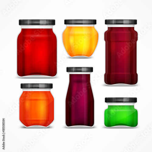 Set of natural jam preserves glass jars and metallic lids.