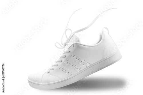 One White sneaker and floating rope  isolated on white background with clipping path