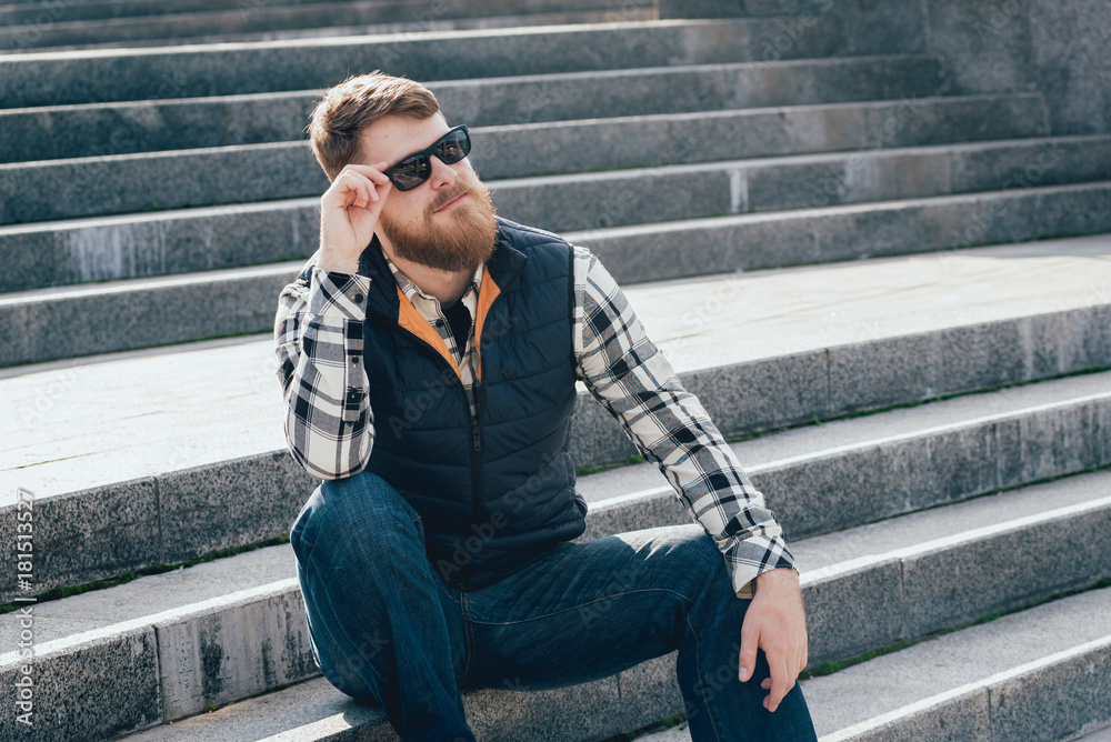 Fototapeta premium Handsome bearded man in casual clothes posing on camera