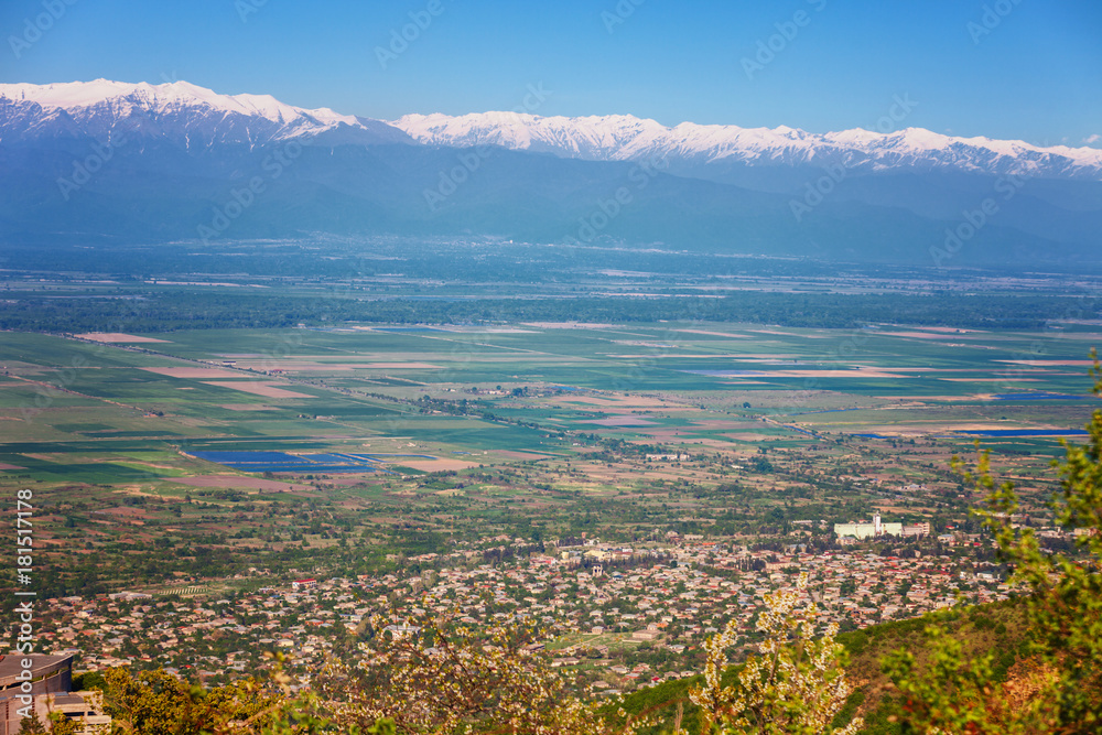 View of Signagi and Alazani Valley with snow on Caucasus mountain chain
