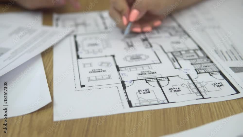 Architect and client at office workplace disscus information about building and working with paper tougether