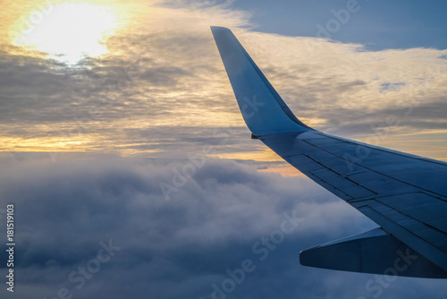 plane wing and sun set sky
