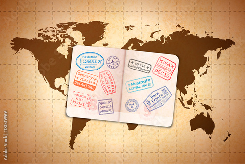 Open foreign passport with international visa stamps on ancient world map on old paper