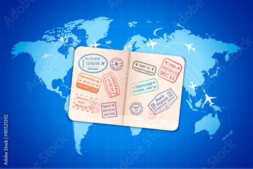 Open foreign passport with international visa stamps on blue world map with airline routes