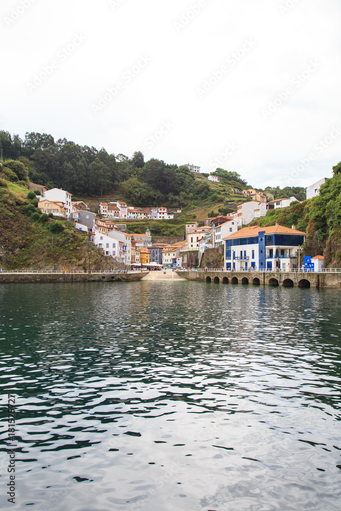 View from water to Cudillero, small fishing village in Asturias, Spain. 