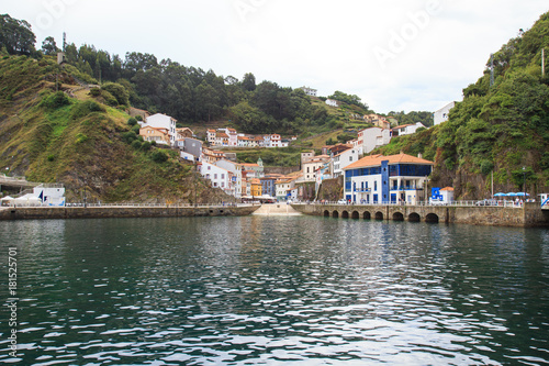 View from water to Cudillero, small fishing village in Asturias, Spain. 