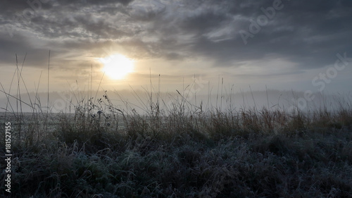 Sunrise in a foggy landscap...