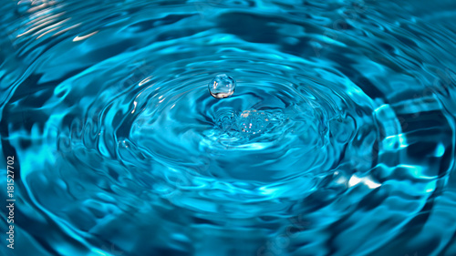 A water drop bounces up in ...