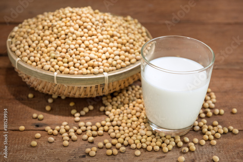 Soy milk and soy bean on wooden background