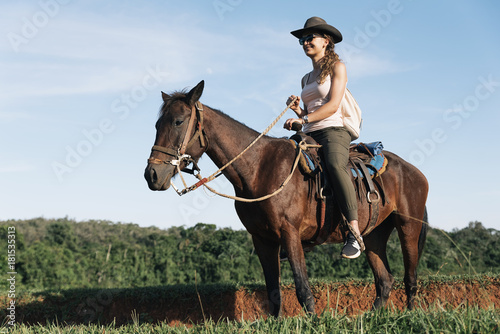 Beautiful woman riding a horse. © santypan