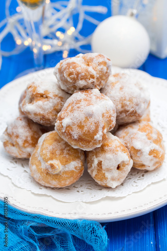 portuguese sweets cavacas on white plate on wooden background photo