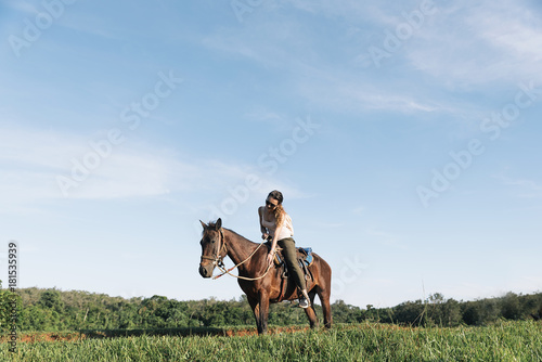 Beautiful woman riding a horse. © santypan