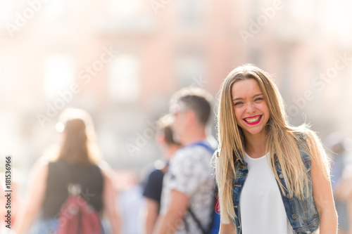 Happy young girl outdoor, front portrait photo with defocused copy space background © tostphoto