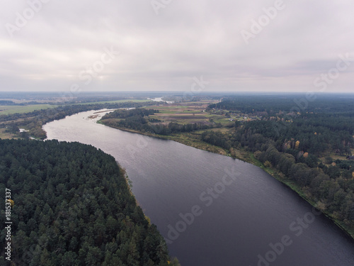 Aerial view over cloudy river Nemunas valley near border in Lithuania. photo