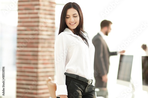 perspective successful young woman in the office