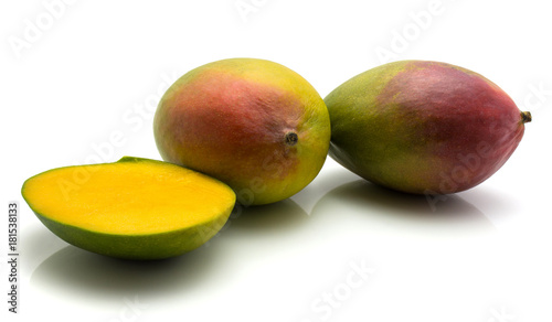 Mango isolated on white background two whole one half.