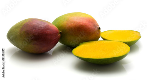 Mango isolated on white background two whole and two halves.