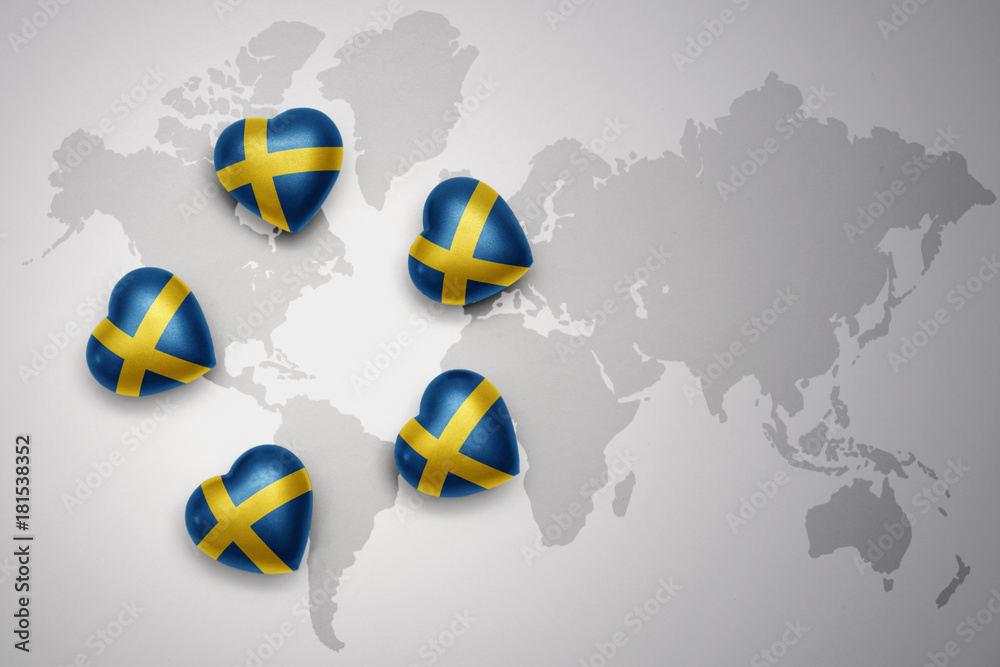 five hearts with national flag of sweden on a world map background. five hearts with national flag of sweden on a world map background.