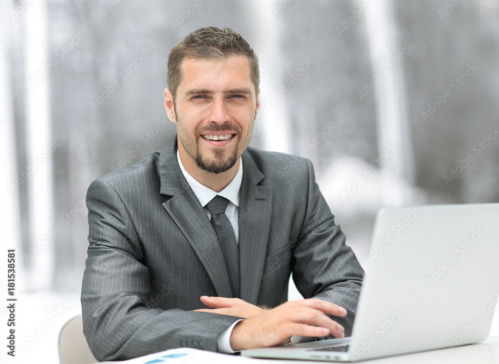 closeup.smiling businessman working with laptop closeup.smiling businessman working with laptop