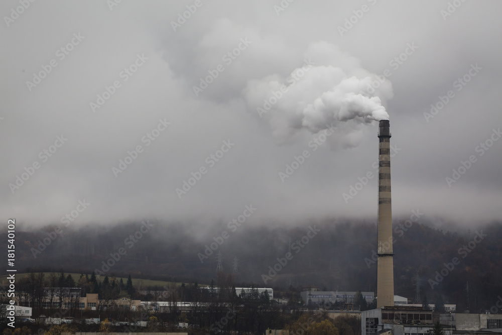 Atmospheric air pollution from Industrial smoke in cloudy rainy day.