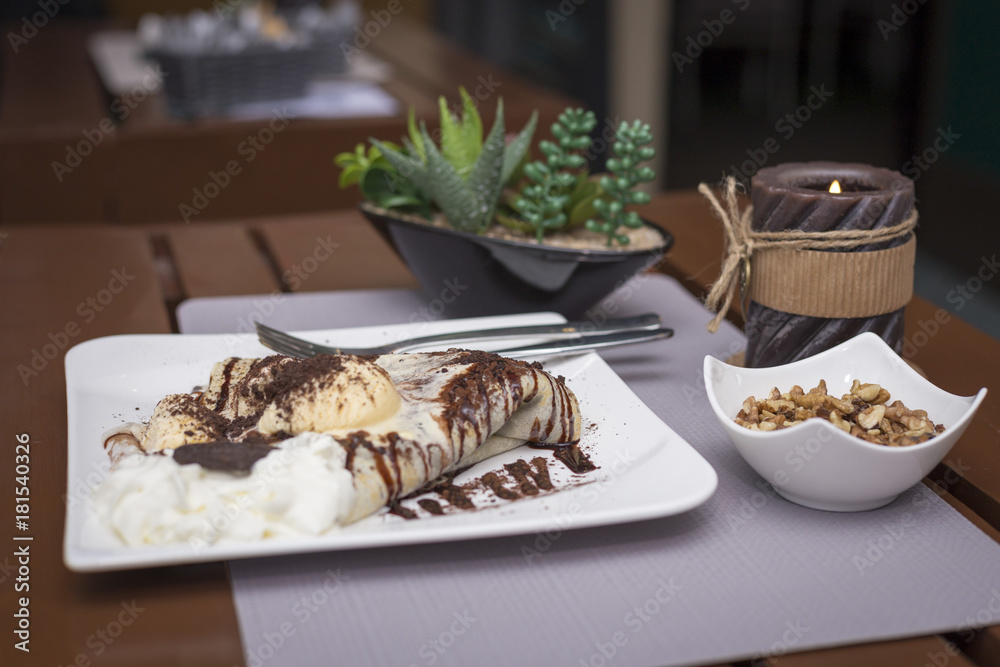 Sweet chocolate pancakes and ice cream romantic restaurant