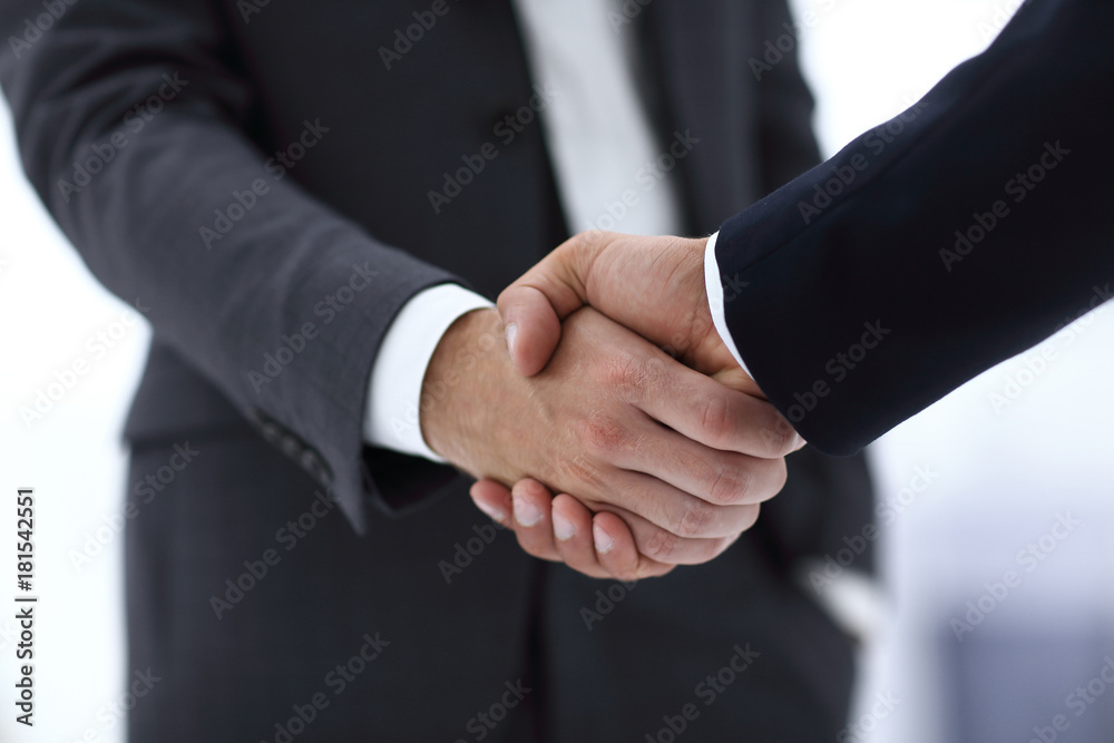 © ASDF - close up of two young male business partner shake hand © ASDF - close up of two young male business partner shake hand