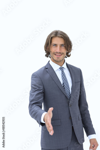 Smiling friendly businessman offers a handshake