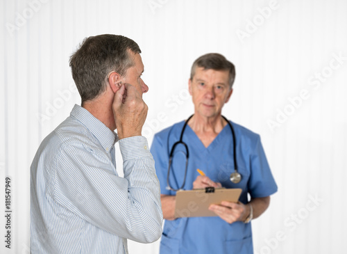 Senior man having hearing test with a doctor