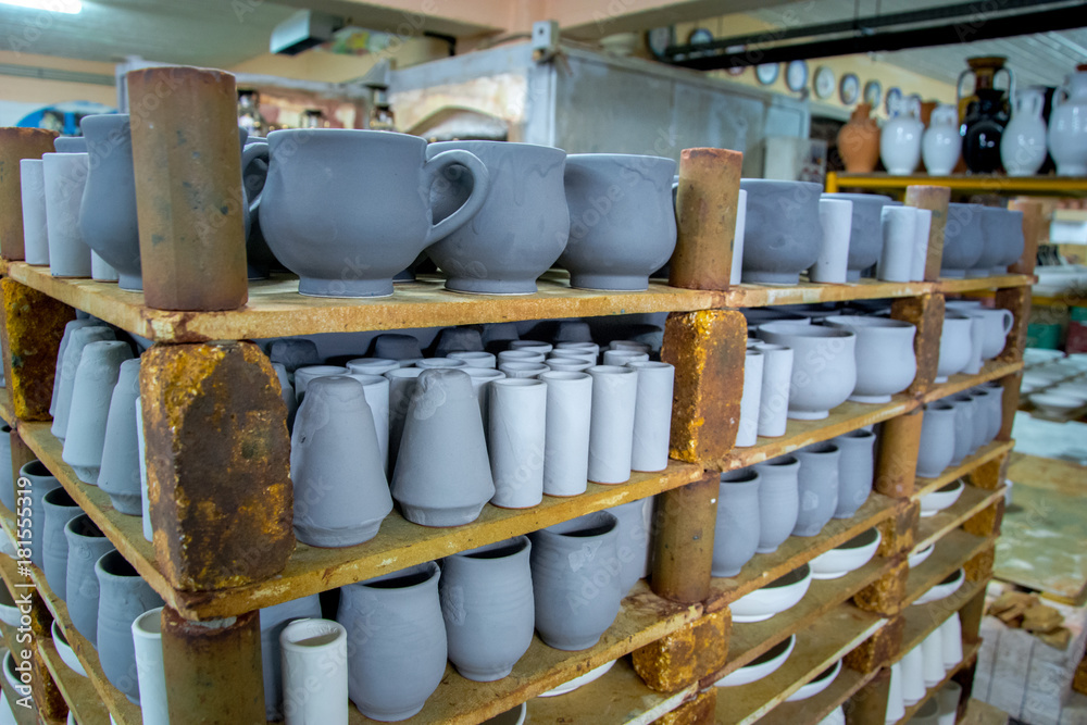 Storage of traditional handmade cups of clay in a pottery, Crete, Greece Storage of traditional handmade cups of clay in a pottery, Crete, Greece