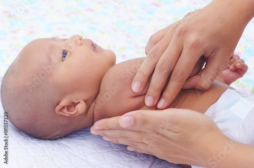 Mother Gently Massage Her Baby Using Baby Oil