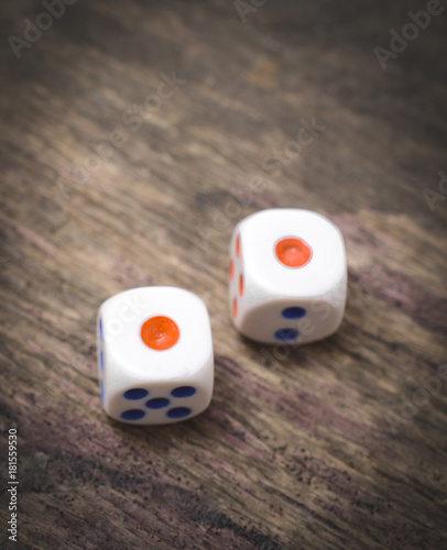 two game dice close up on the wooden table