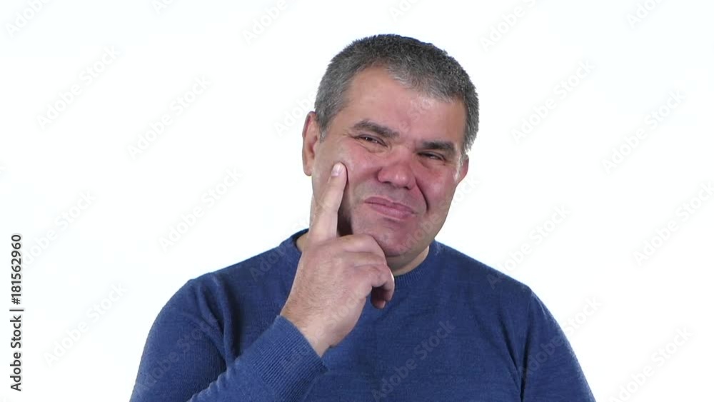 Man thinks about his life. White background . Close up. Slow motion Man thinks about his life. White background . Close up. Slow motion