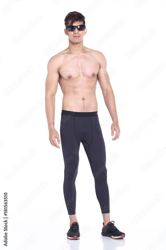 Fototapeta premium Full body length portrait of a young man wearing fitness sporty outfit