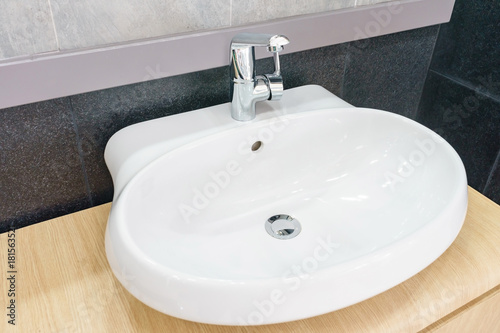 Interior of bathroom with sink basin faucet and mirror. Modern design of bathroom