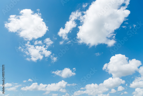 clear blue sky with plain white cloud with space for text background. The vast blue sky and clouds. blue sky background with tiny clouds nature. 