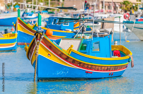 Traditional Luzzu boat at Marsaxlokk harbor in Malta.