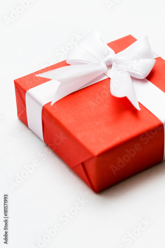 Christmas present in a red gift box on white background. Festive season concept