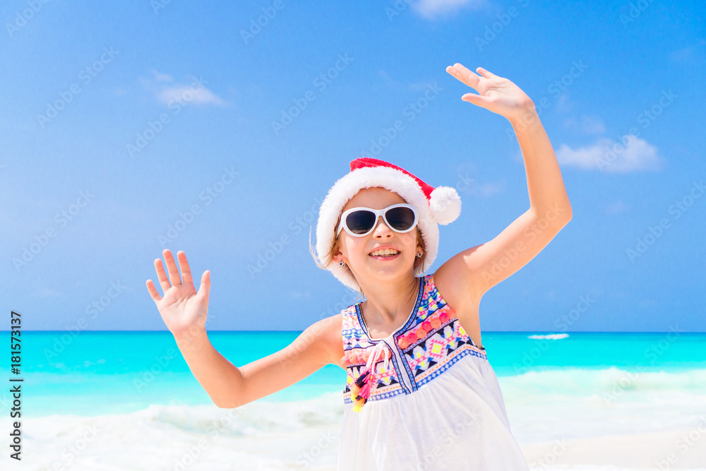 Little girl making photo on phone of family at the beach Little girl making photo on phone of family at the beach